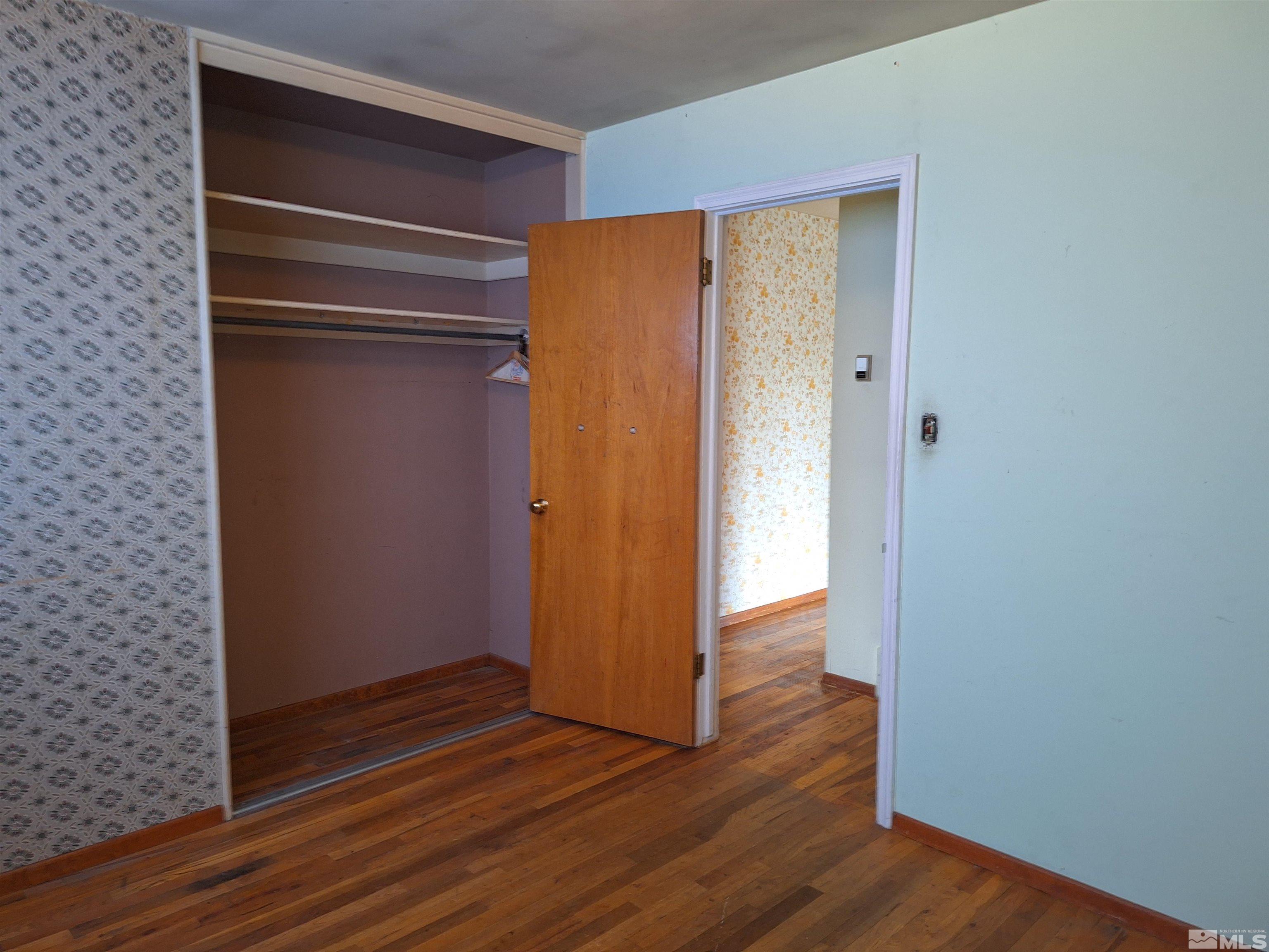 820 Ruby Avenue Reno, NV 89503 - Photo 23 of 30 a view of an empty room with wooden floor