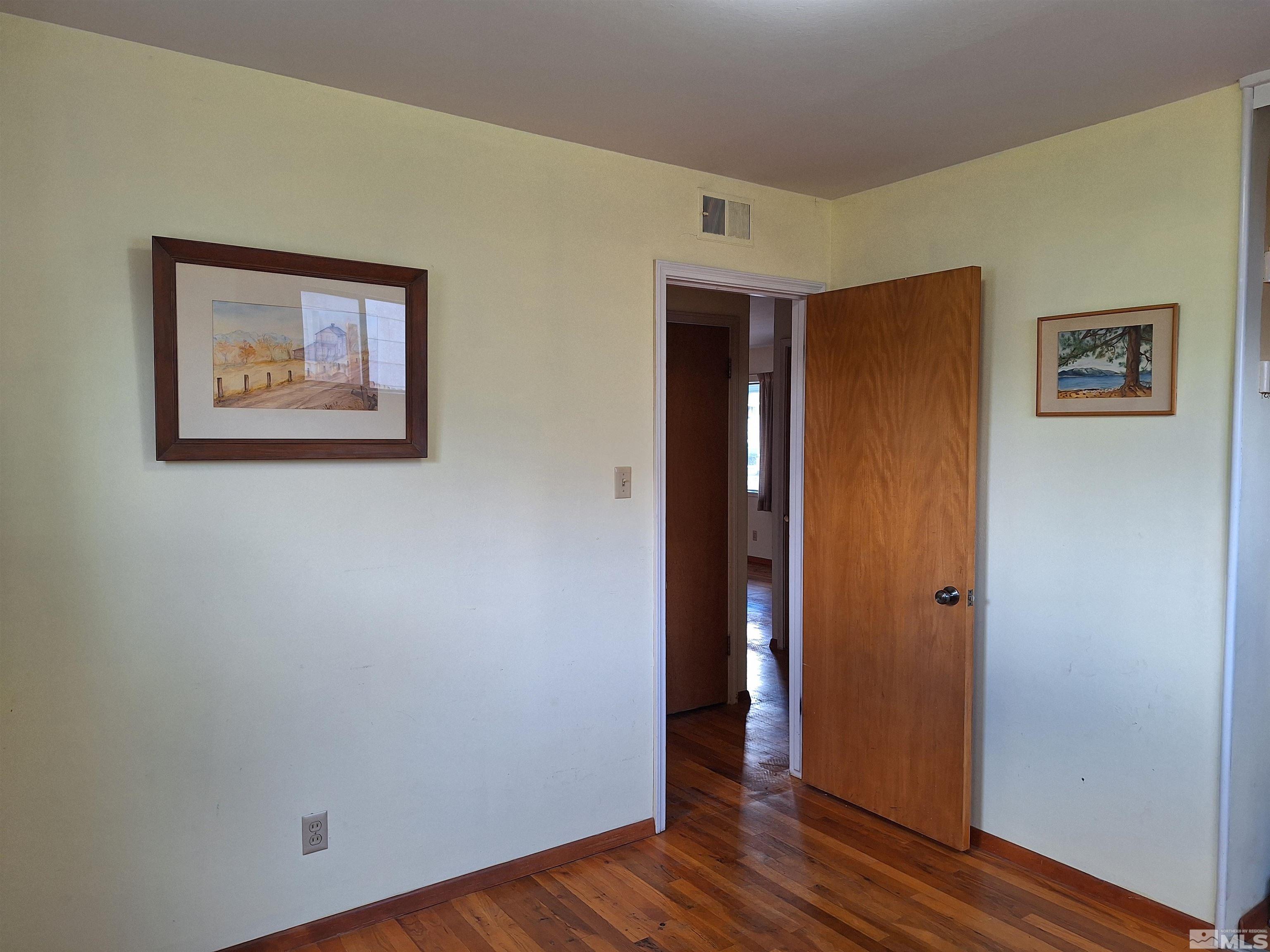 820 Ruby Avenue Reno, NV 89503 - Photo 25 of 30 an empty room with wooden floor and closet