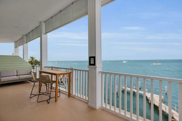 a view of a balcony with furniture