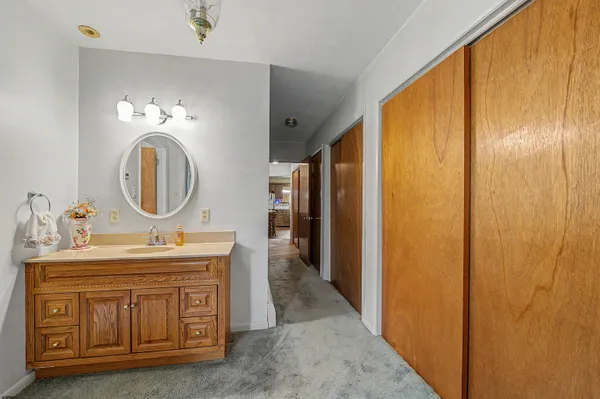 a bathroom with a glass shower door