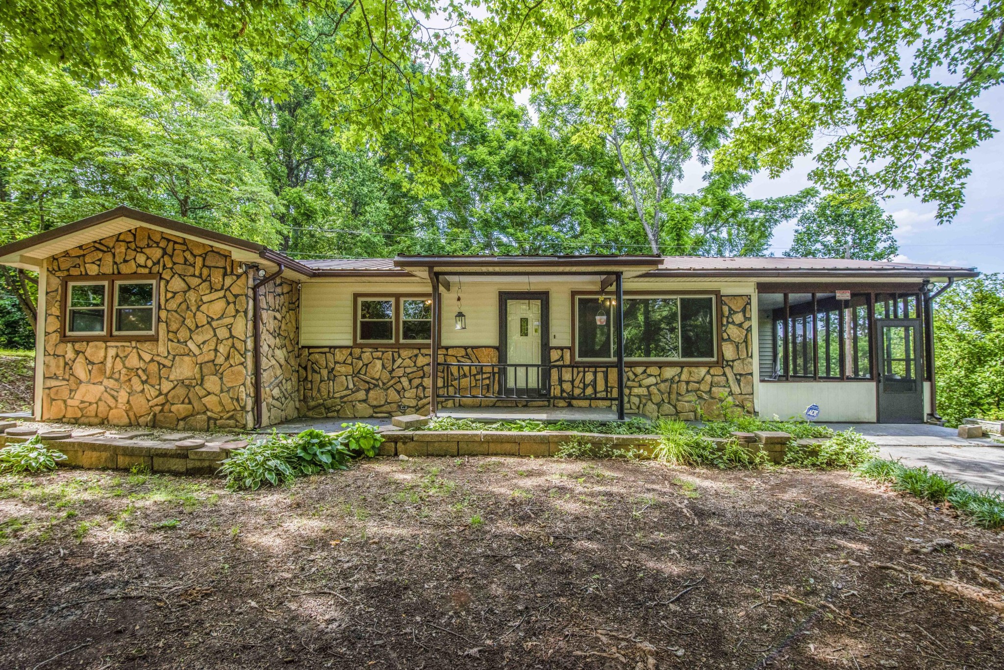 1455 Kiser Road Philadelphia, TN 37846 - Photo 1 of 40 a front view of a house with a yard