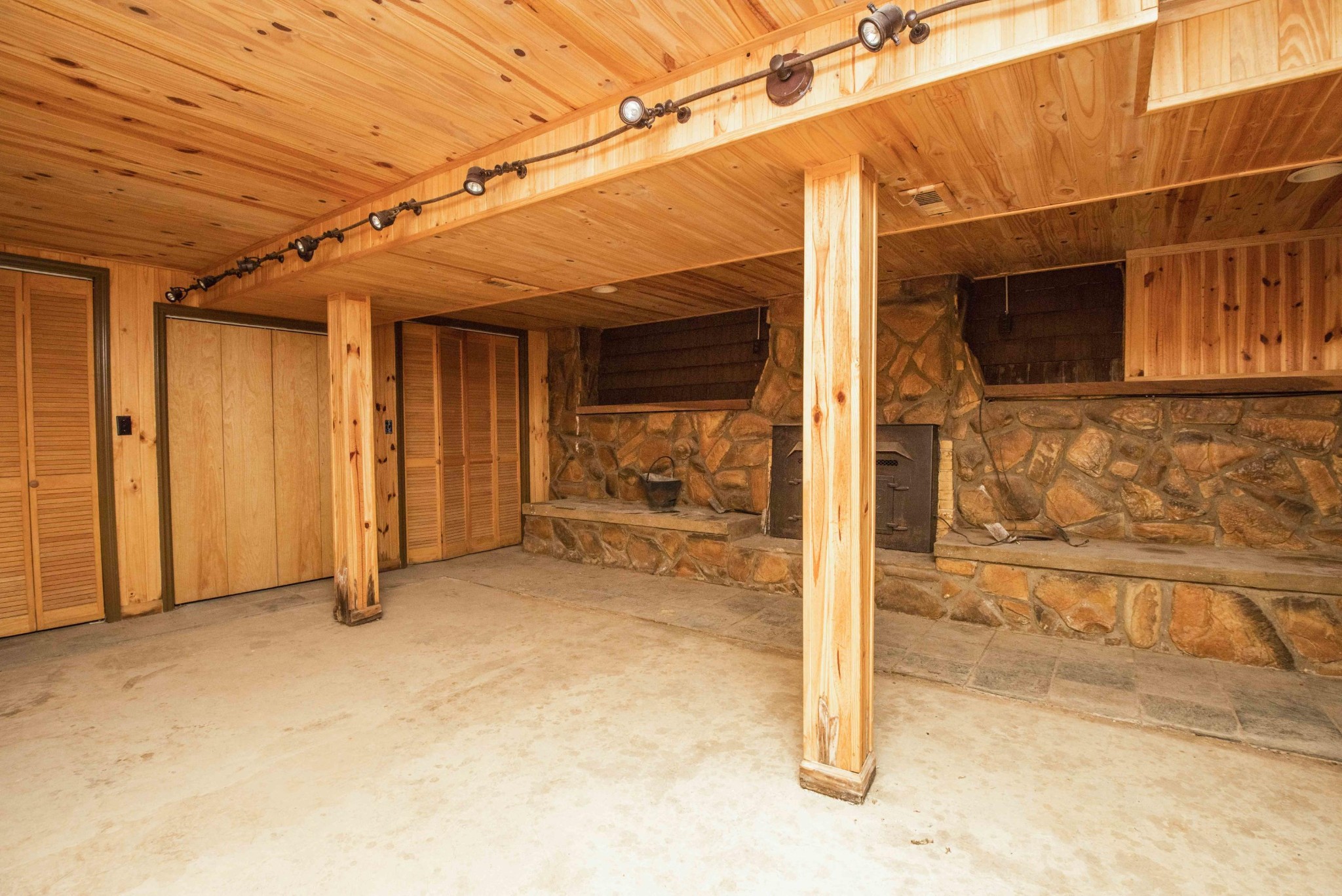 1455 Kiser Road Philadelphia, TN 37846 - Photo 24 of 40 a view of a room with wooden walls and iron stairs