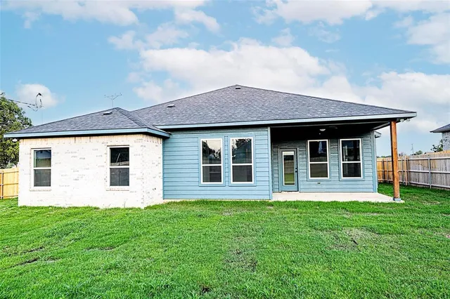 front view of a house with a yard