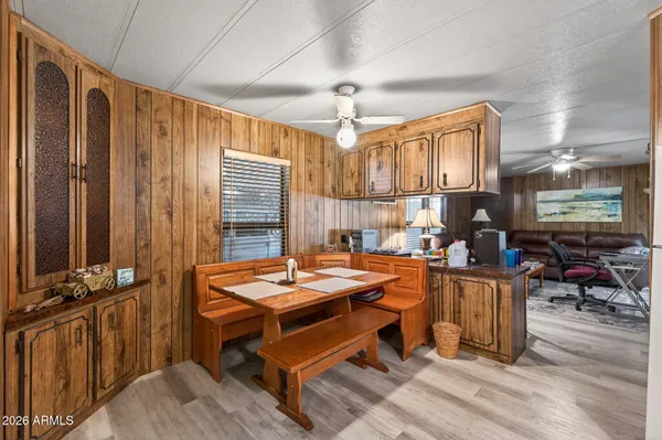 a dining room with furniture and window