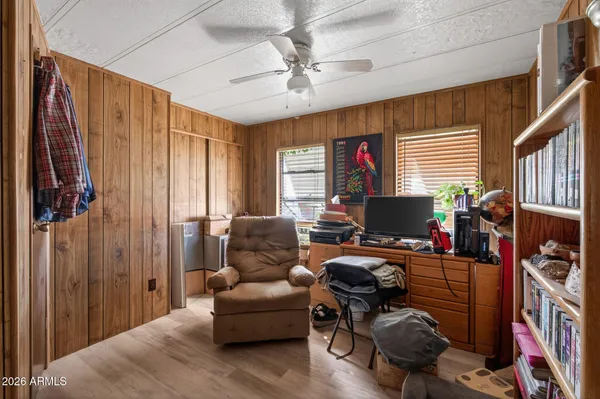 a livingroom with workspace and a couch