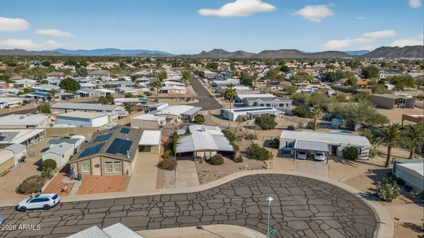 an aerial view of residential houses with outdoor space