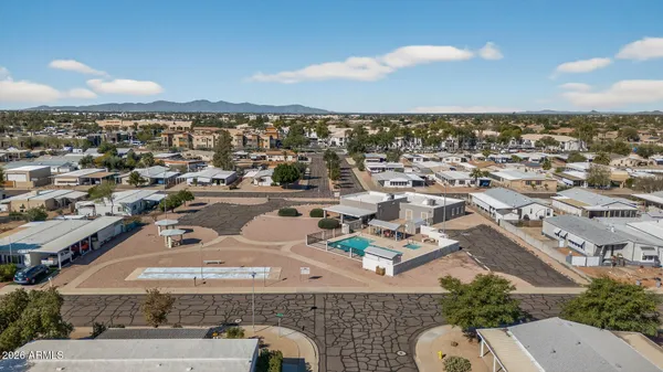 an aerial view of residential houses with outdoor space