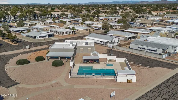 an aerial view of residential houses with outdoor space