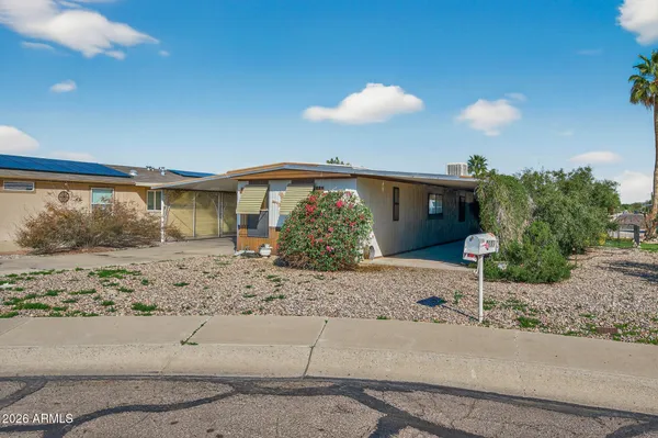 a view of a house with a street