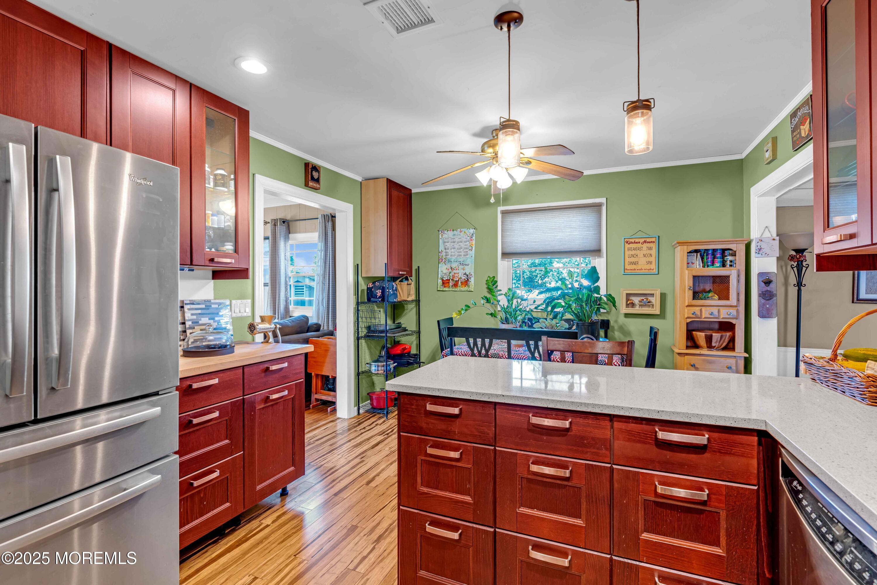 64 Roland Street Keansburg, NJ 07734 - Photo 13 of 38 a kitchen with stainless steel appliances granite countertop a refrigerator a oven and a sink with large cabinets