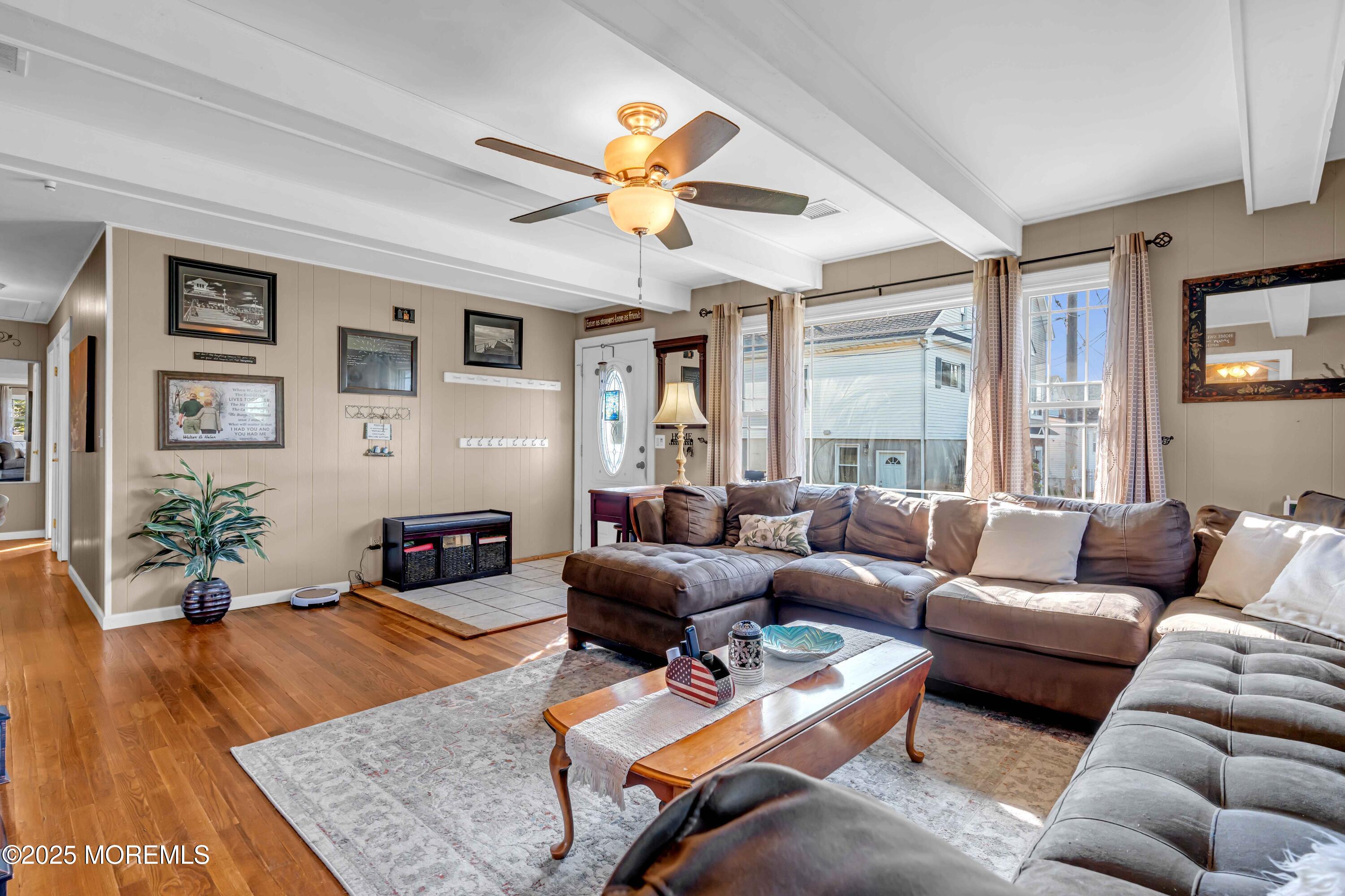 64 Roland Street Keansburg, NJ 07734 - Photo 2 of 38 a living room with furniture wooden floor and a large window