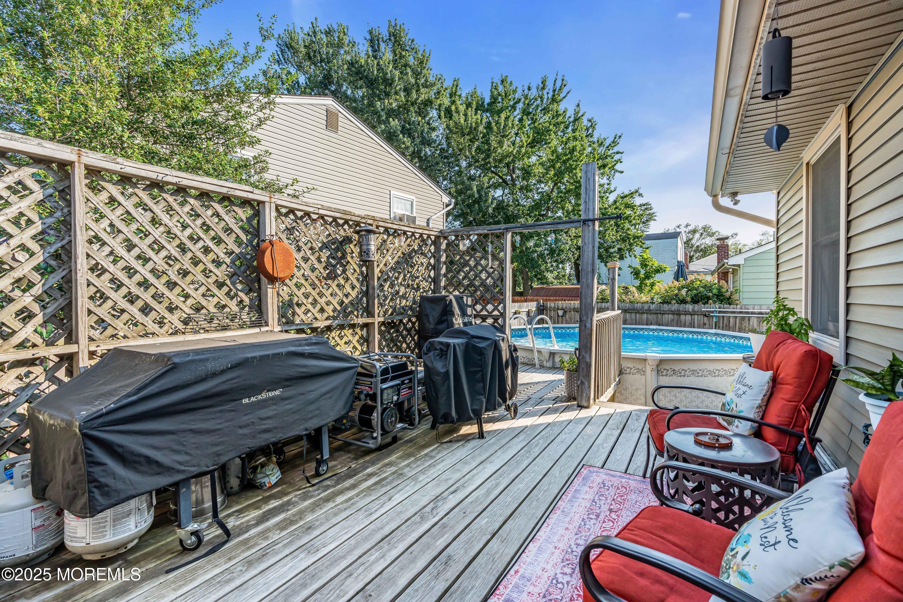 64 Roland Street Keansburg, NJ 07734 - Photo 24 of 38 a view of a deck with furniture