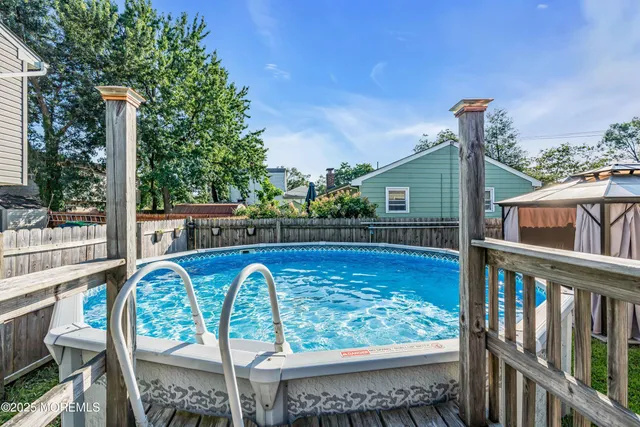 a view of a balcony with lake view and wooden floor
