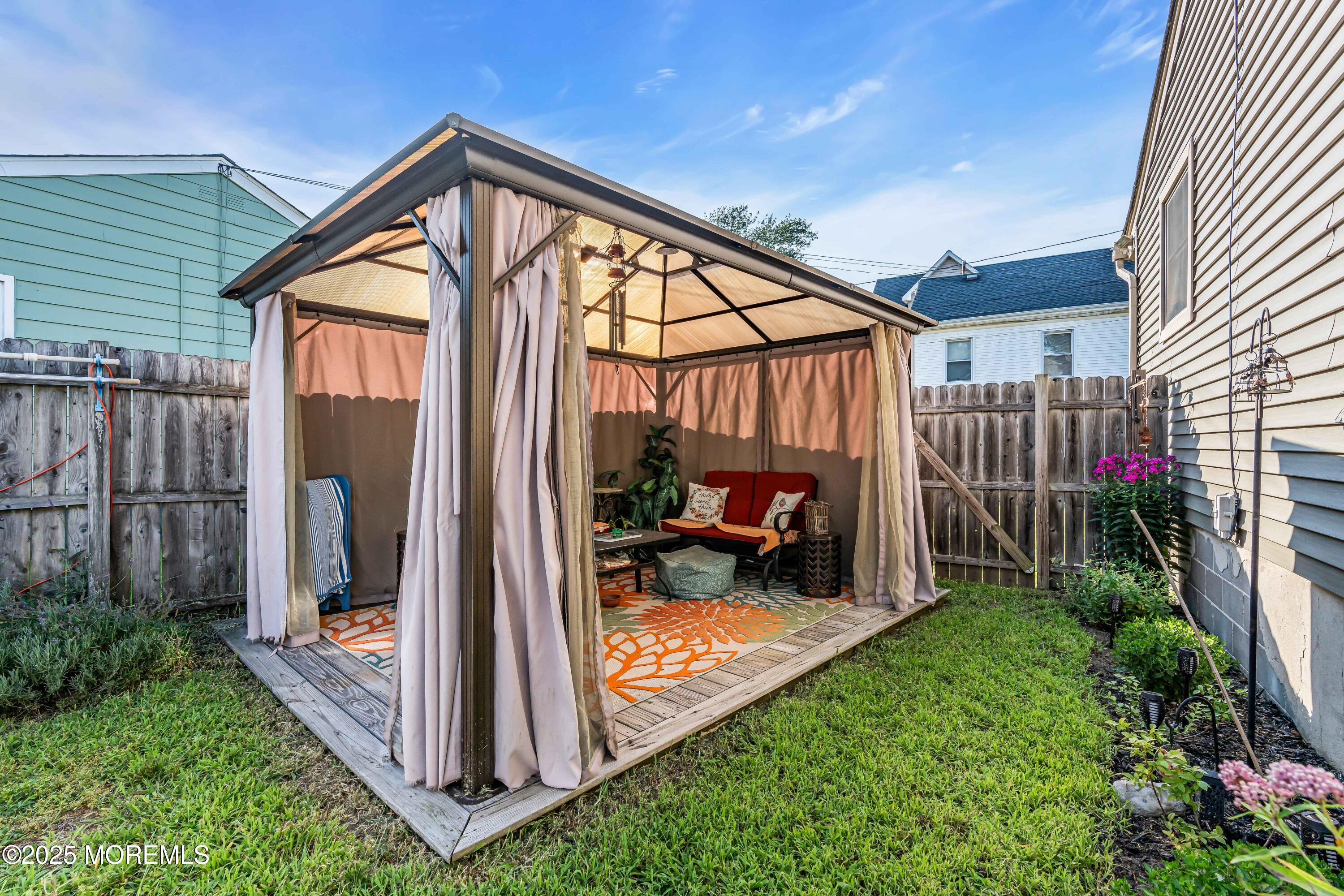 64 Roland Street Keansburg, NJ 07734 - Photo 30 of 38 a view of a backyard door and garden