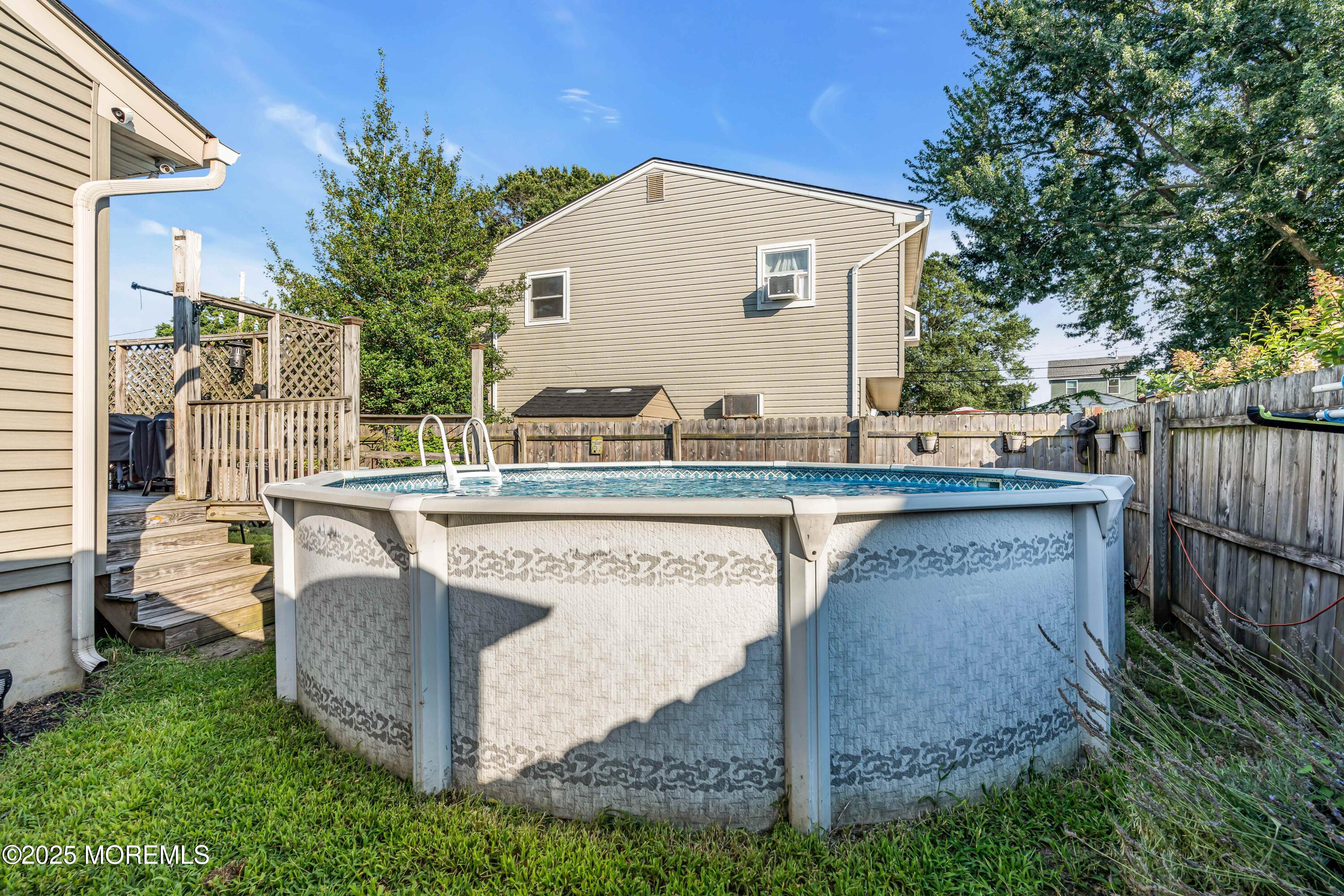 64 Roland Street Keansburg, NJ 07734 - Photo 33 of 38 a view of a house with backyard and sitting area