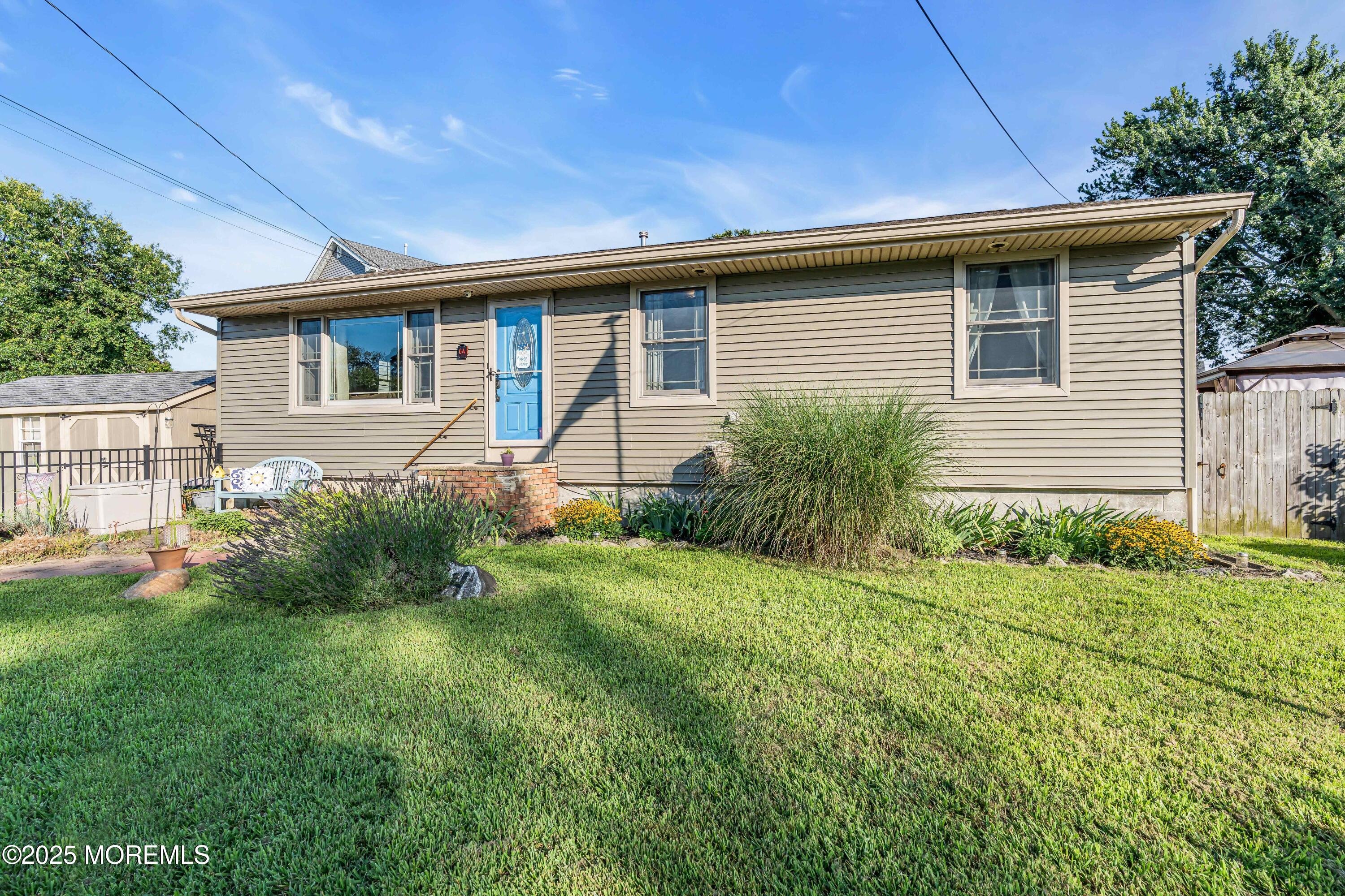64 Roland Street Keansburg, NJ 07734 - Photo 34 of 38 a front view of house with yard and green space