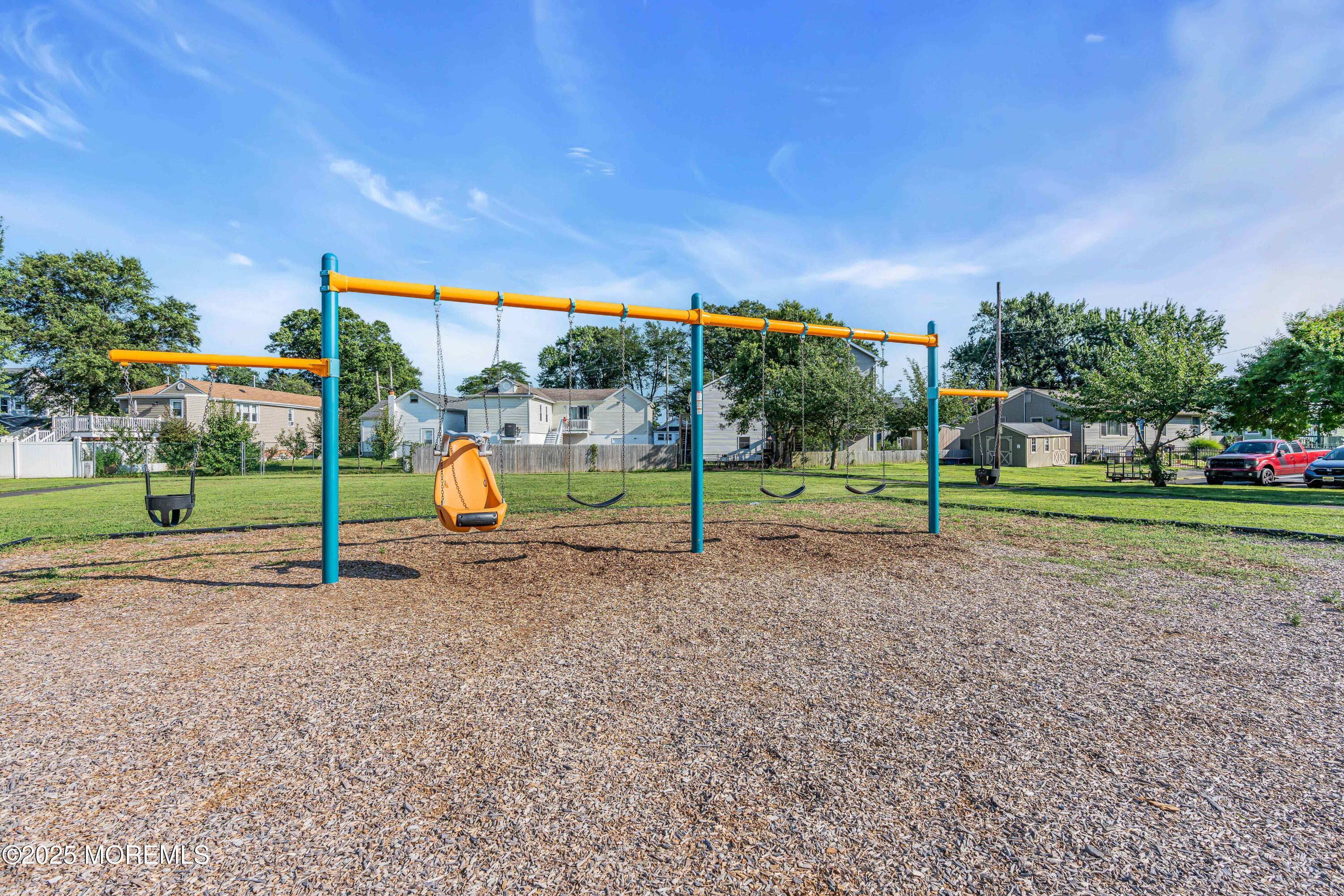 64 Roland Street Keansburg, NJ 07734 - Photo 36 of 38 a view of a park with swings