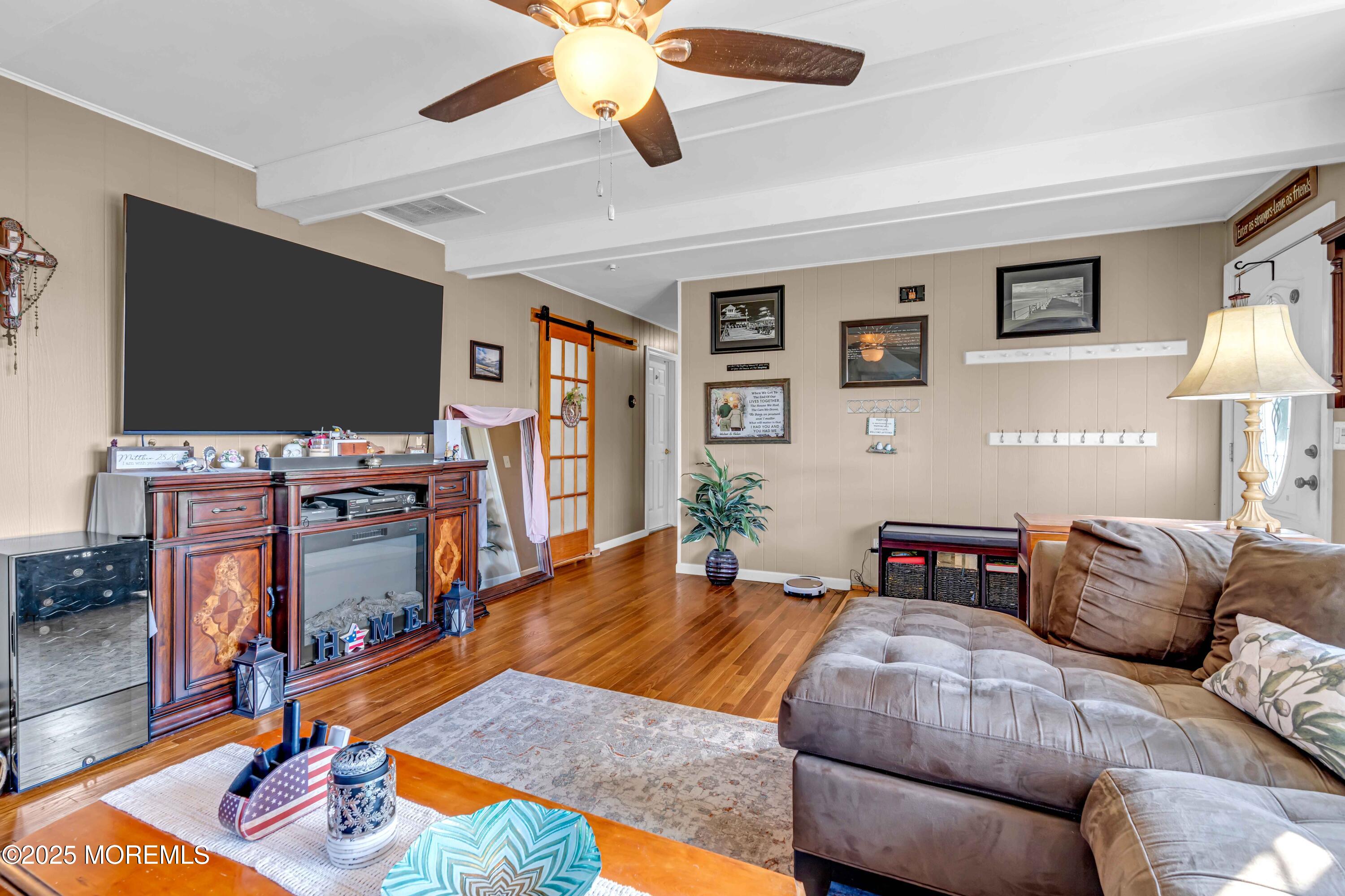 64 Roland Street Keansburg, NJ 07734 - Photo 4 of 38 a bedroom with a bed and a flat screen tv