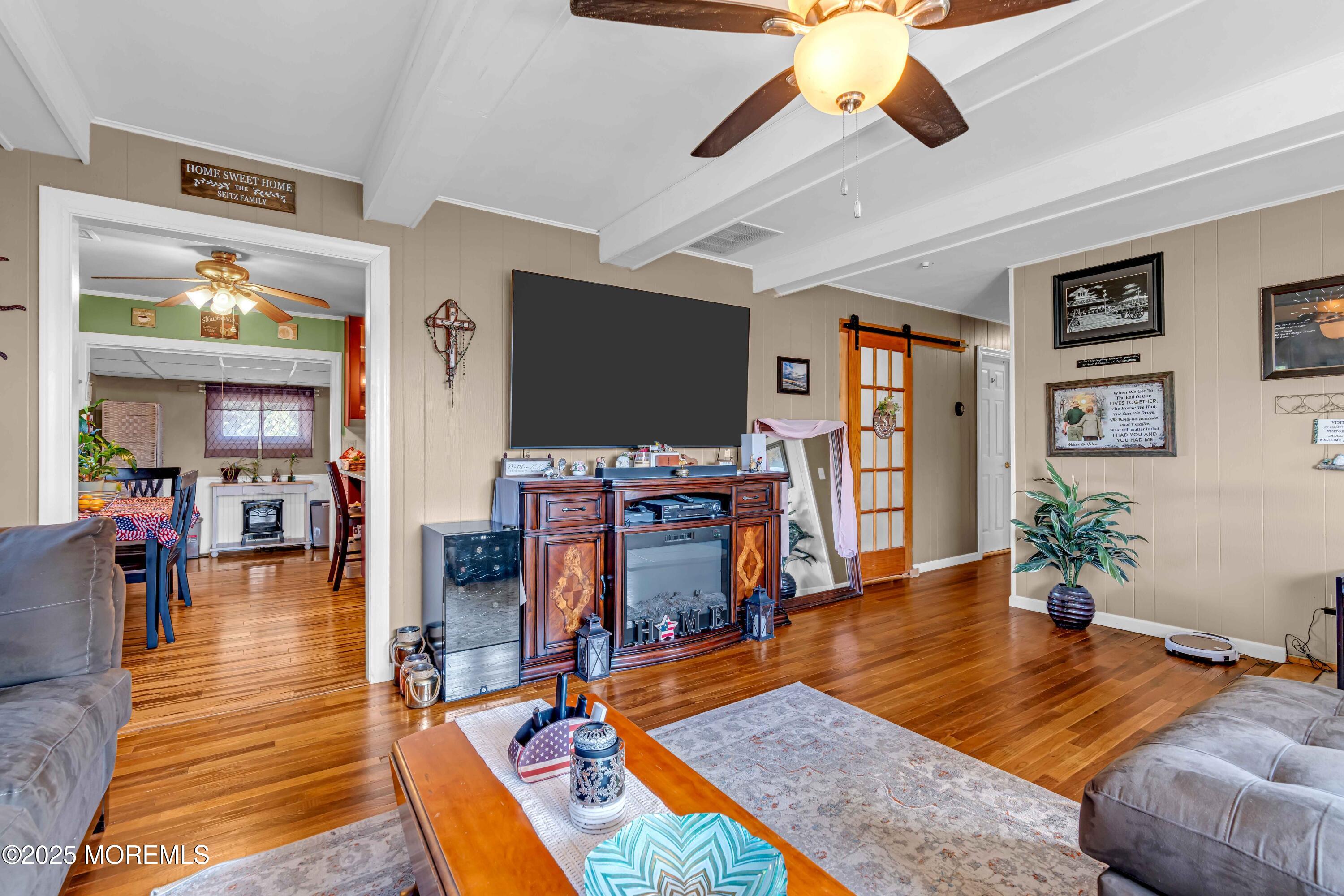 64 Roland Street Keansburg, NJ 07734 - Photo 5 of 38 a living room with furniture and a flat screen tv