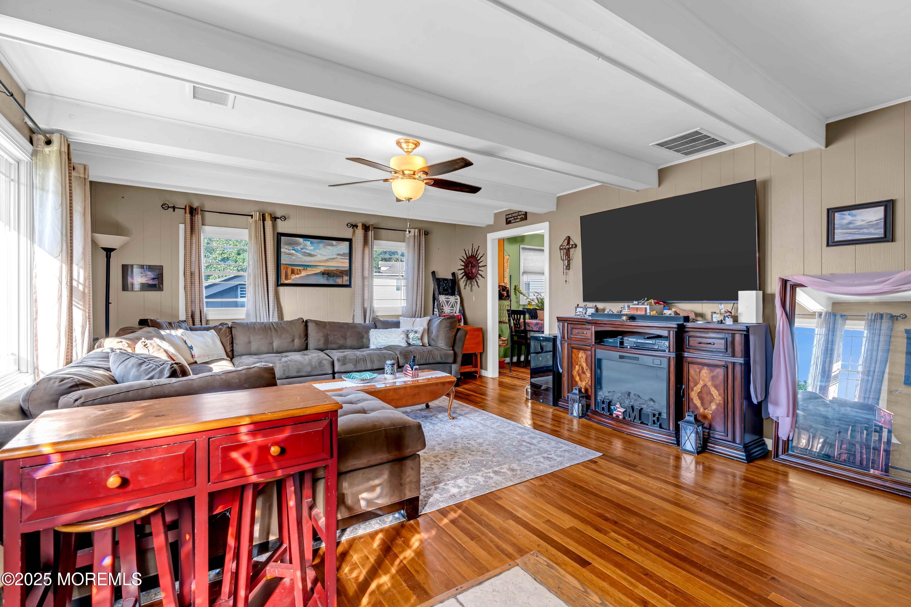 64 Roland Street Keansburg, NJ 07734 - Photo 8 of 38 a living room with furniture and a flat screen tv