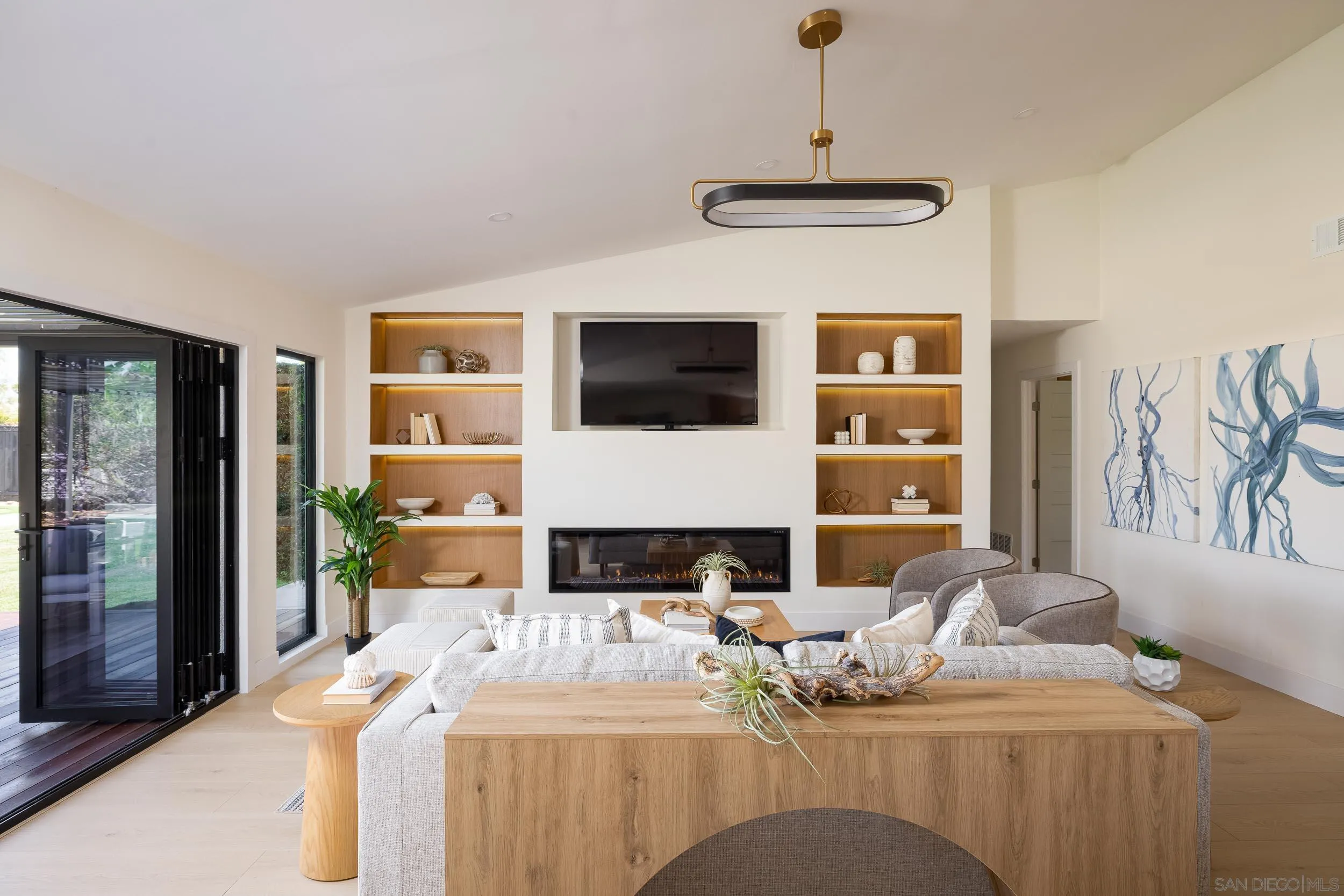 1502 Vanessa Circle Encinitas, CA 92024 - Photo 12 of 40 a living room with fireplace furniture and a flat screen tv