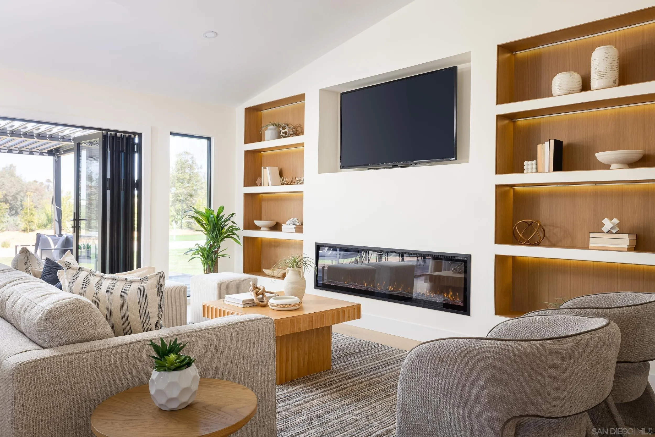 1502 Vanessa Circle Encinitas, CA 92024 - Photo 16 of 40 a living room with furniture and a flat screen tv