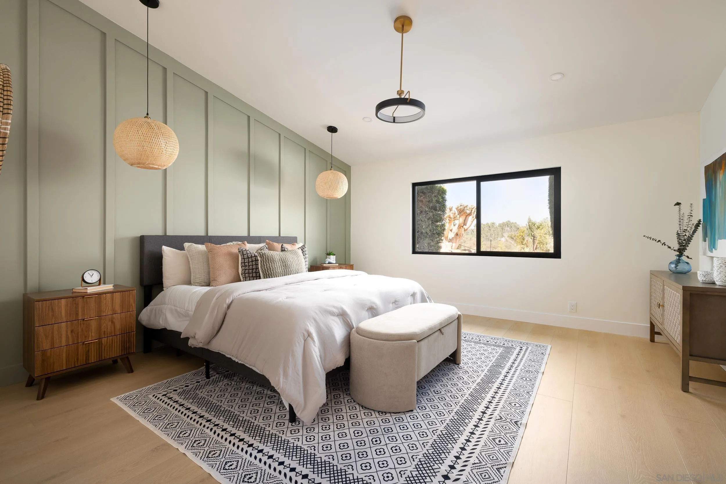 1502 Vanessa Circle Encinitas, CA 92024 - Photo 19 of 40 a spacious bedroom with a bed and a table