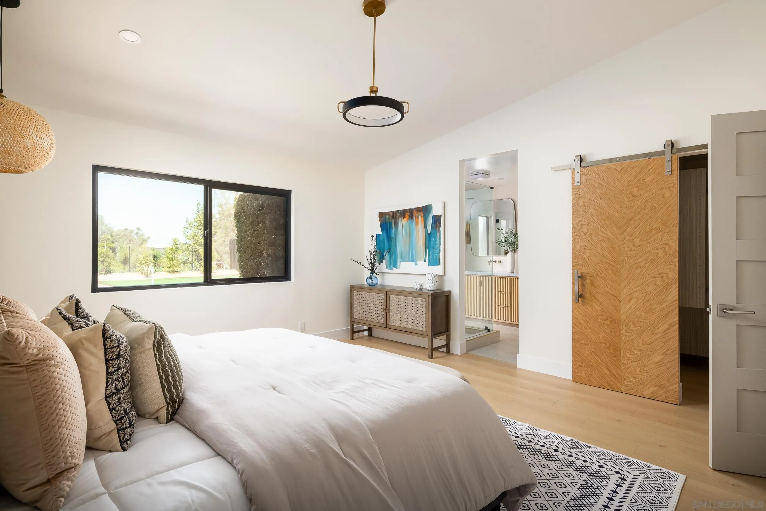 1502 Vanessa Circle Encinitas, CA 92024 - Photo 20 of 40 a bedroom with a large bed and a window