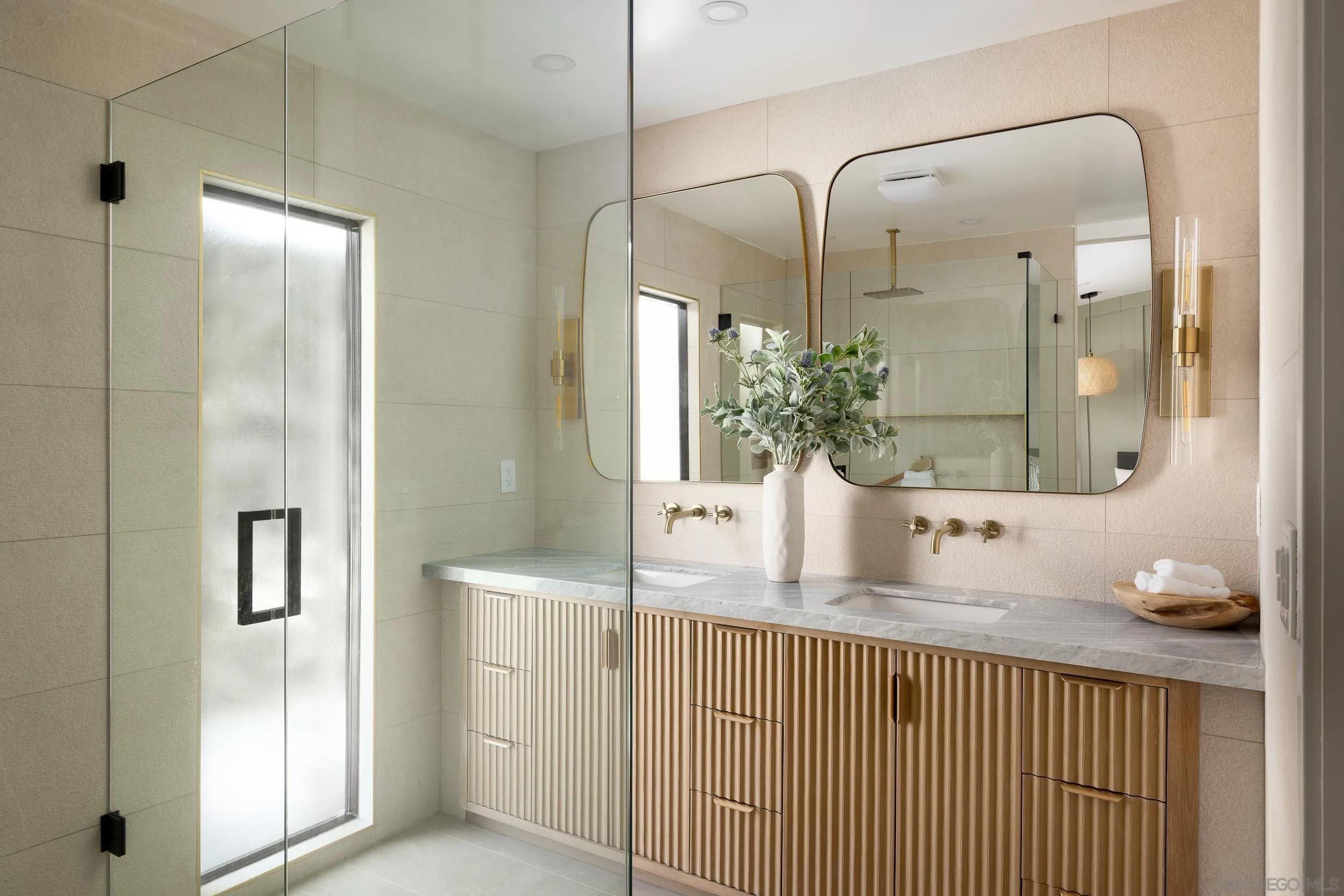 1502 Vanessa Circle Encinitas, CA 92024 - Photo 22 of 40 a bathroom with a granite countertop shower a sink and a mirror