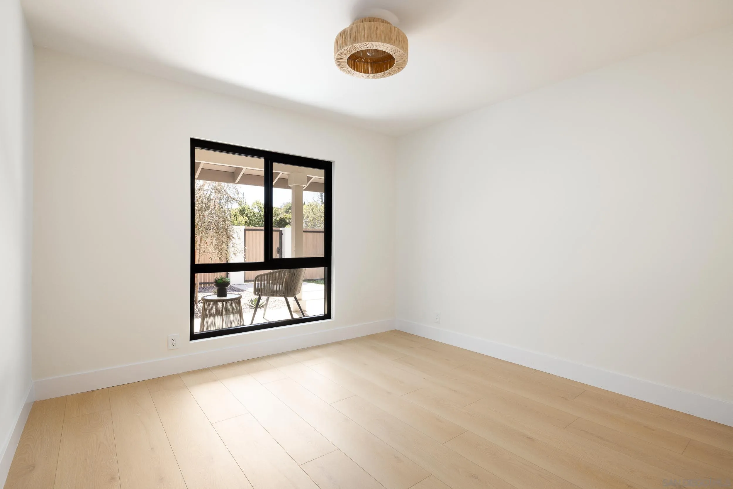 1502 Vanessa Circle Encinitas, CA 92024 - Photo 26 of 40 an empty room with wooden floor and windows