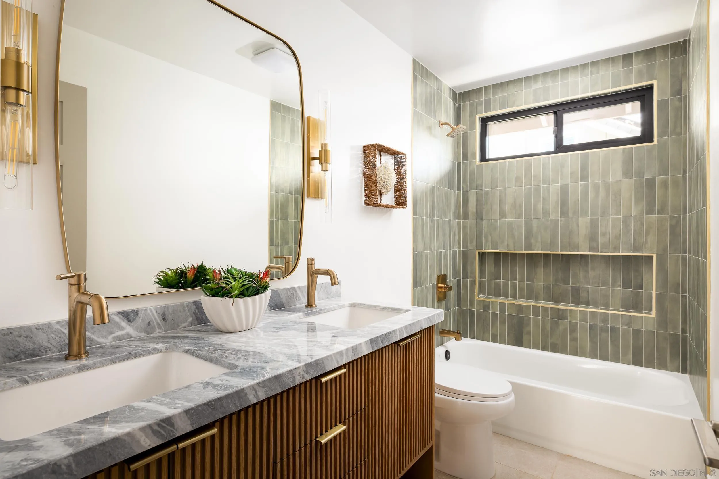 1502 Vanessa Circle Encinitas, CA 92024 - Photo 27 of 40 a bathroom with a granite countertop sink toilet and shower