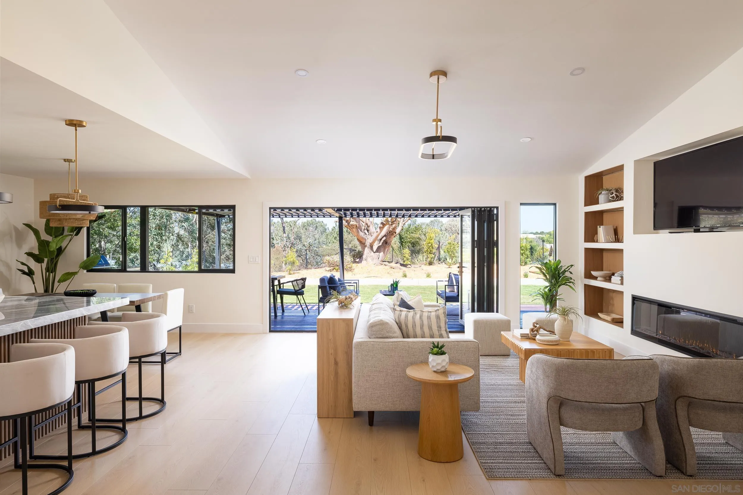 1502 Vanessa Circle Encinitas, CA 92024 - Photo 7 of 40 a living room with fireplace furniture and a large window