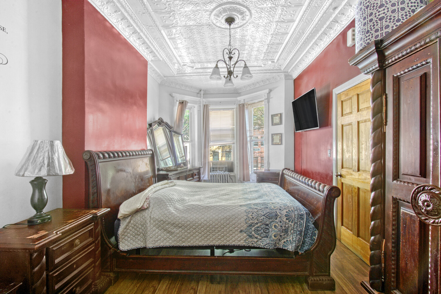 614 St Johns Place Brooklyn, NY 11238 - Photo 2 of 34 a bedroom with a bed dresser and a window