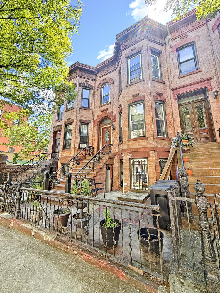 614 St Johns Place Brooklyn, NY 11238 - Photo 31 of 34 front view of a building with a bench