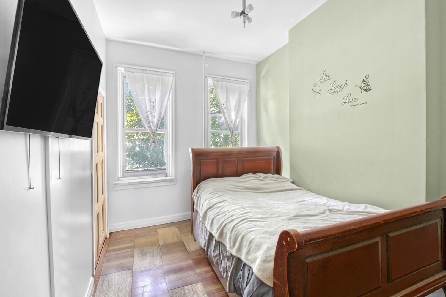 614 St Johns Place Brooklyn, NY 11238 - Photo 5 of 34 a bedroom with a bed and a window