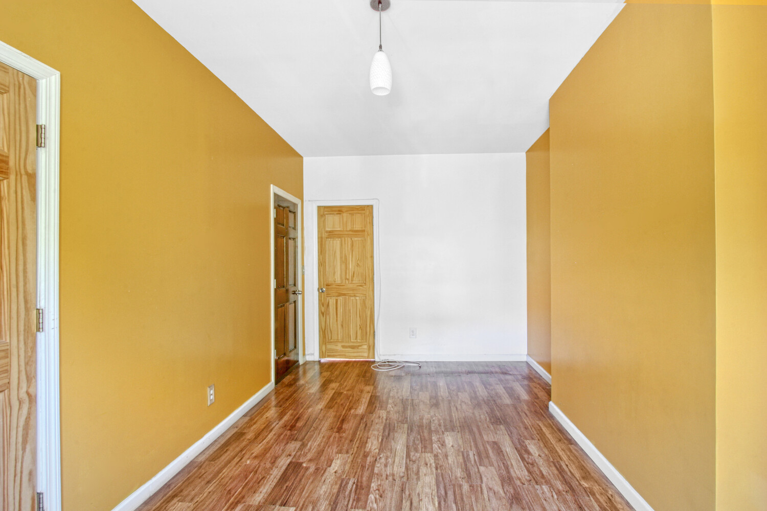 614 St Johns Place Brooklyn, NY 11238 - Photo 8 of 34 a view of a hallway with wooden floor
