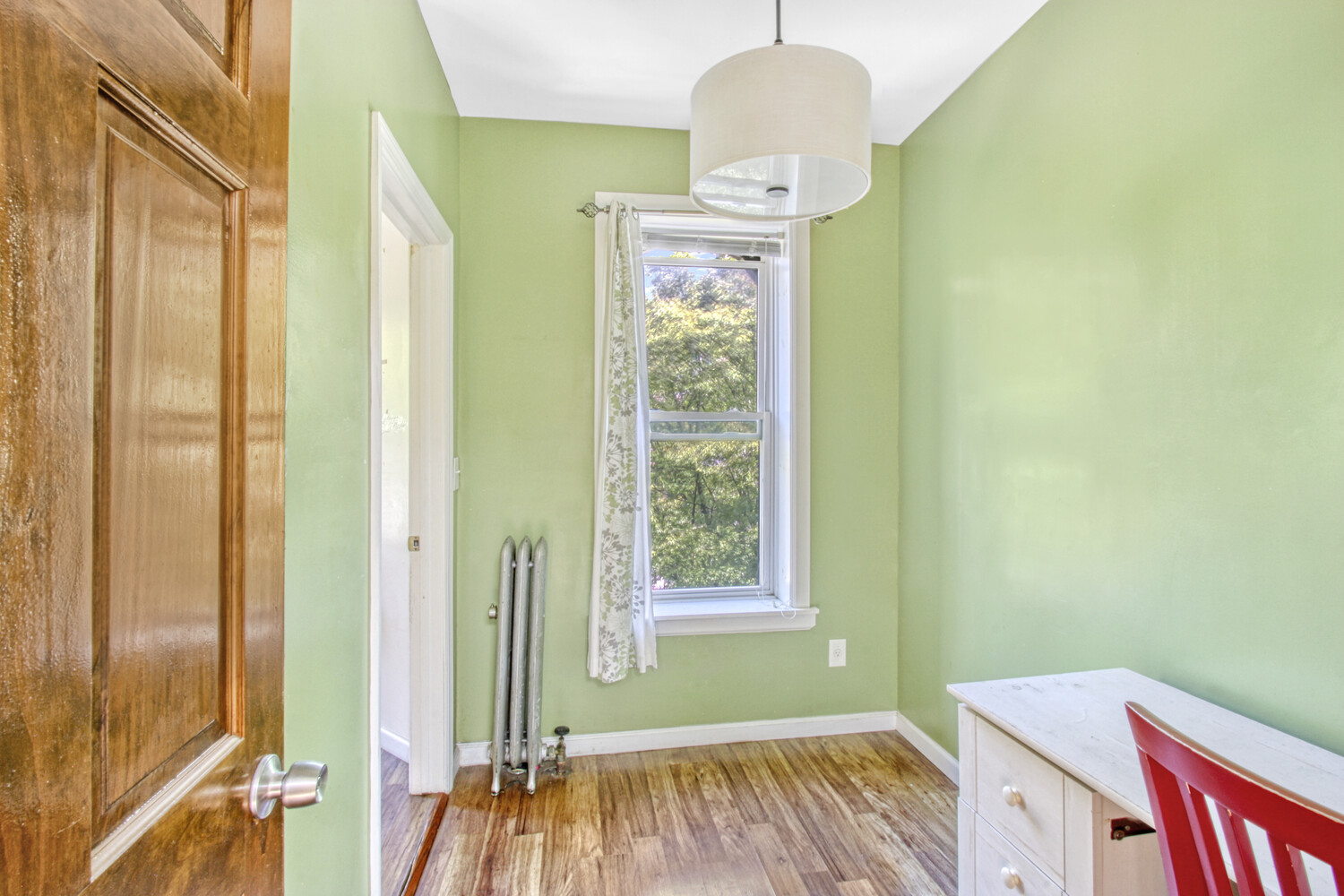 614 St Johns Place Brooklyn, NY 11238 - Photo 9 of 34 a view of a bedroom with wooden floor and windows