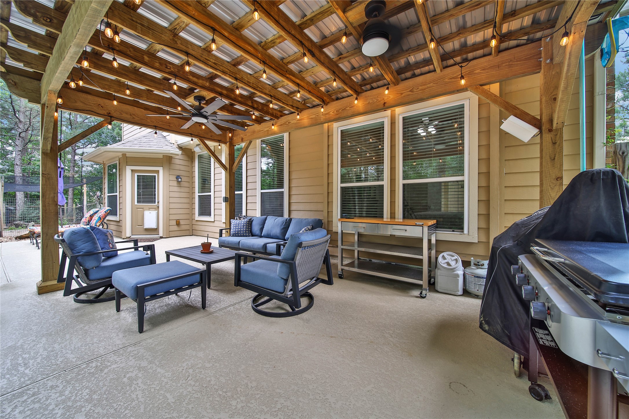 9223 Wapiti Trail Conroe, TX 77303 - Photo 37 of 45 a living room with furniture and a chandelier