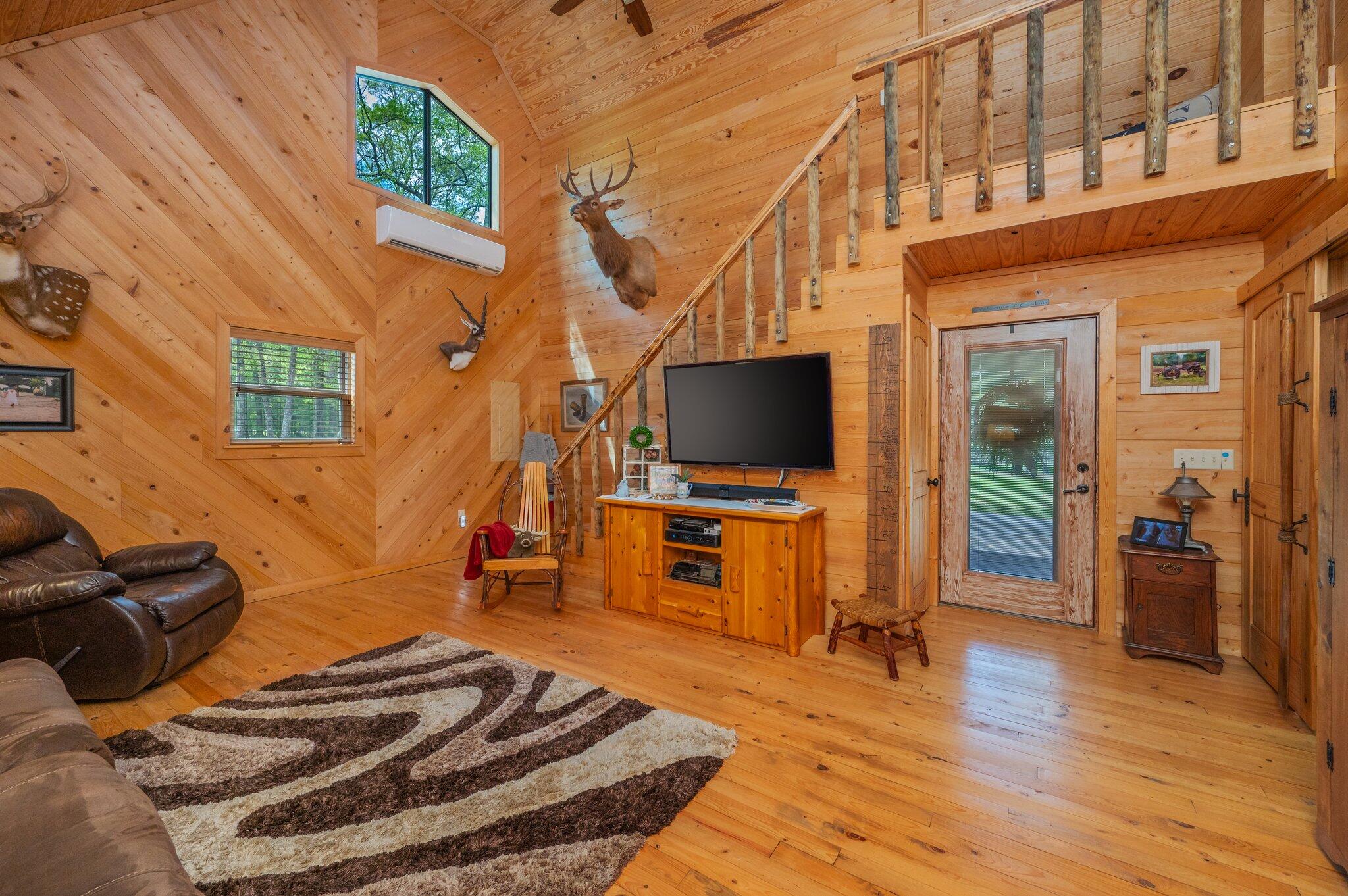 8109 Highway 189 Baker, FL 32531 - Photo 12 of 95 a bedroom with furniture and a flat screen tv