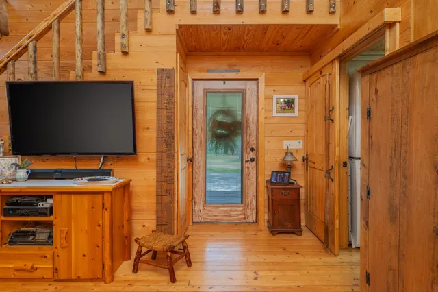 a outdoor space with a couch and the view of the entryway