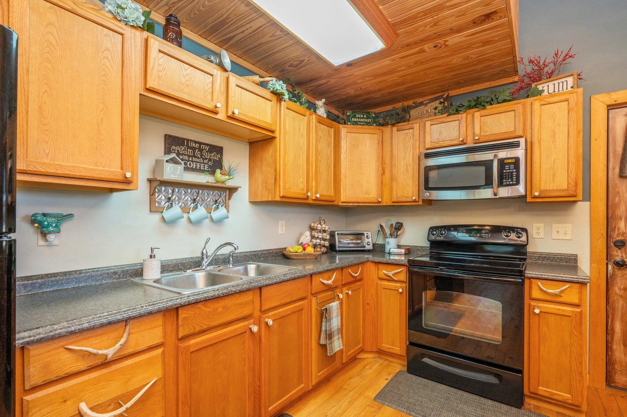 8109 Highway 189 Baker, FL 32531 - Photo 19 of 95 a kitchen with stainless steel appliances granite countertop a sink a stove and cabinets