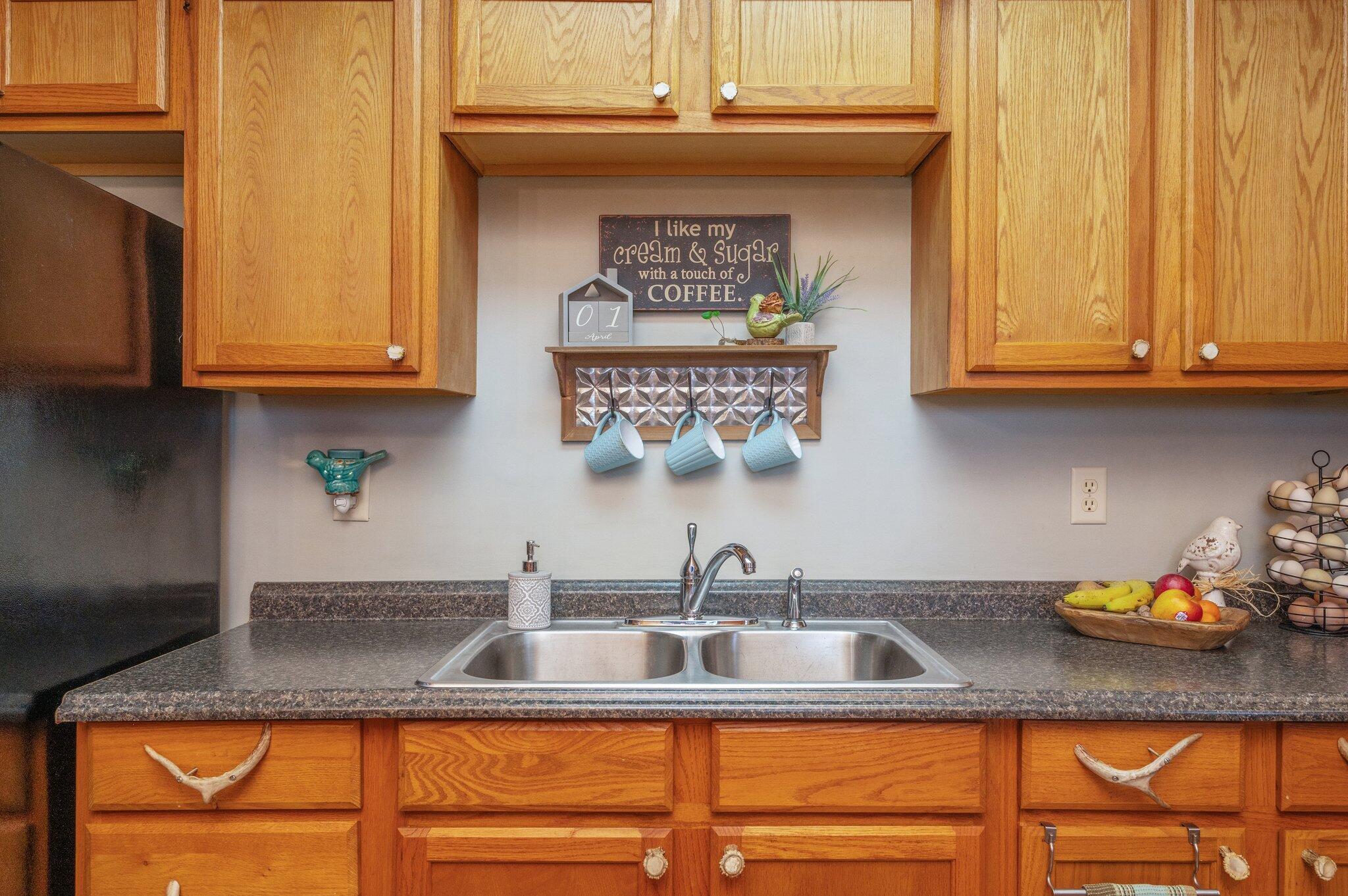 8109 Highway 189 Baker, FL 32531 - Photo 21 of 95 a kitchen with stainless steel appliances granite countertop a sink and cabinets