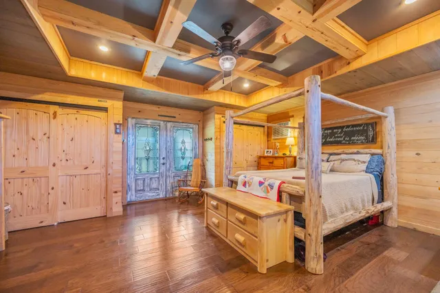 a bedroom with a bed and a window