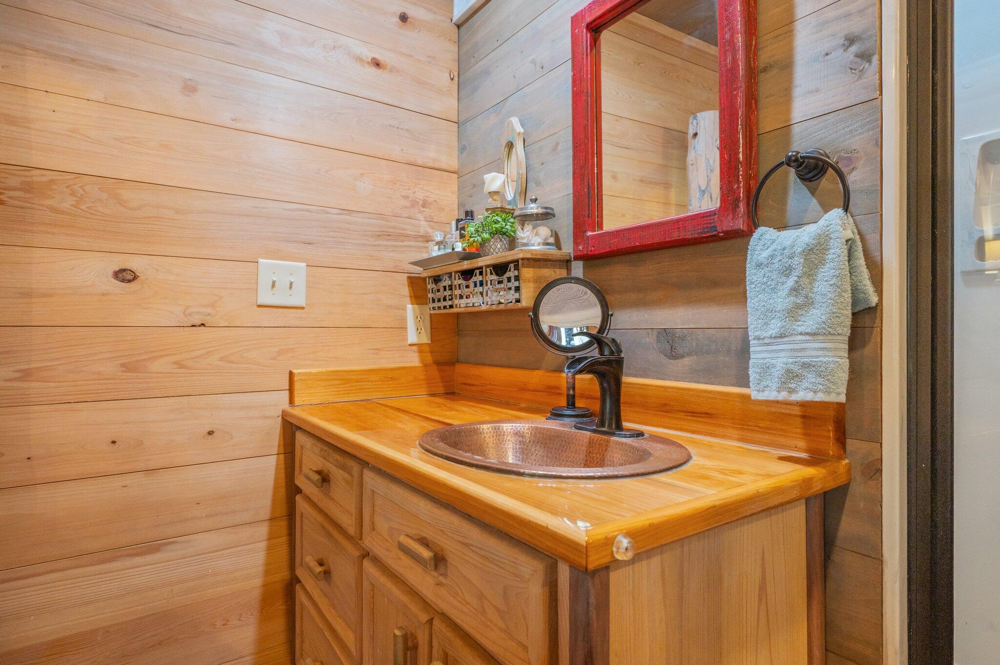 8109 Highway 189 Baker, FL 32531 - Photo 32 of 95 a bathroom with a sink and a mirror
