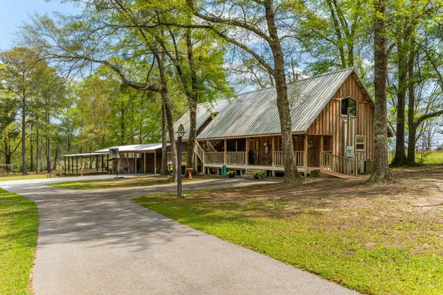 a bedroom with furniture and a flat screen tv