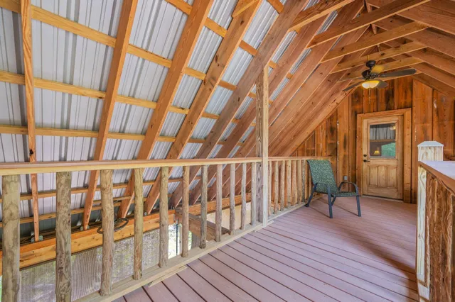 a view of a house with garden and trees