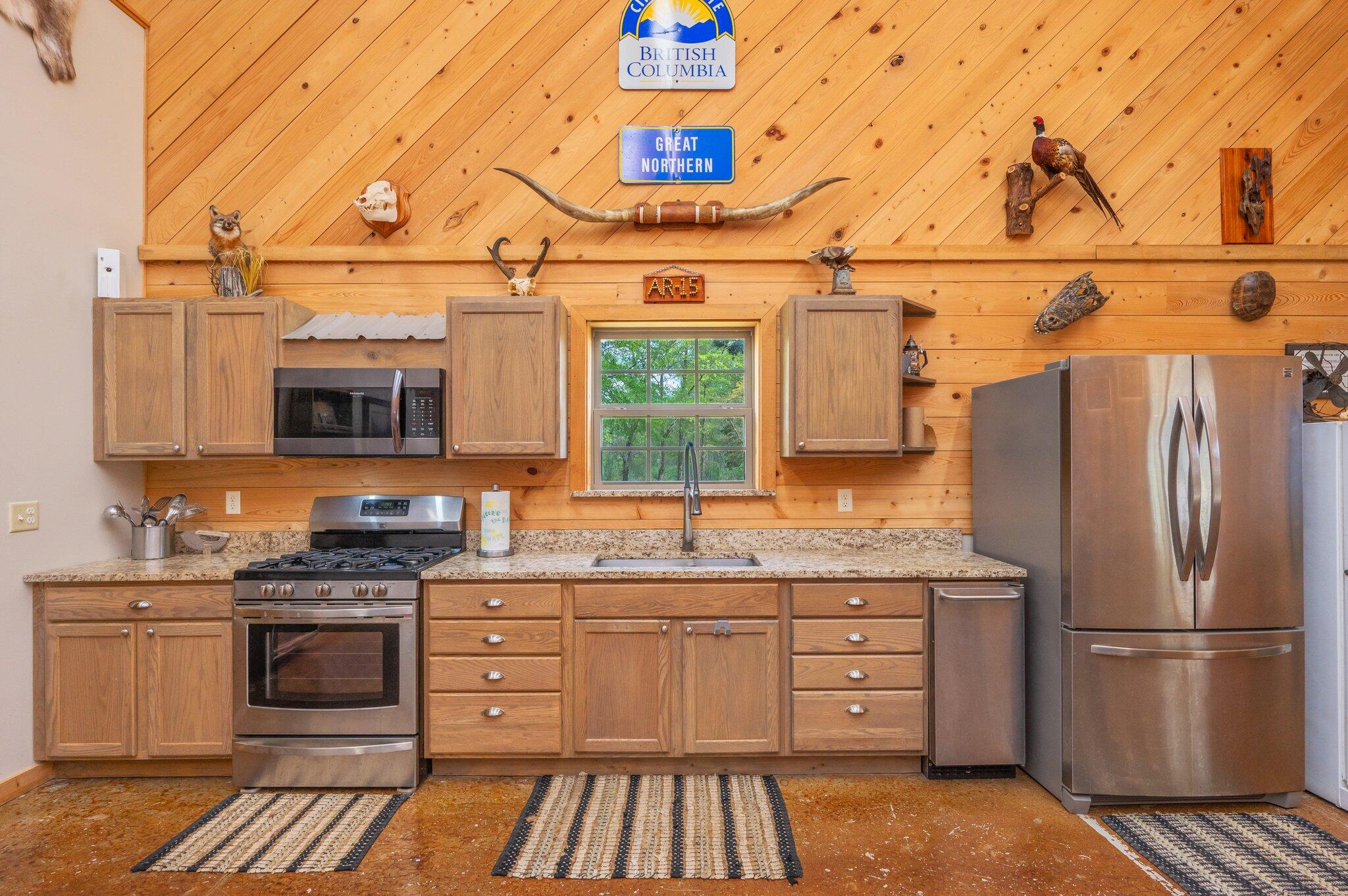8109 Highway 189 Baker, FL 32531 - Photo 60 of 95 a kitchen with stainless steel appliances a stove sink and refrigerator