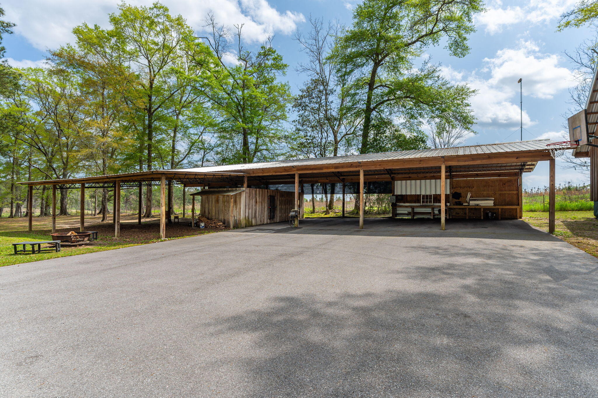 8109 Highway 189 Baker, FL 32531 - Photo 81 of 95 a view of a house with a backyard and a patio