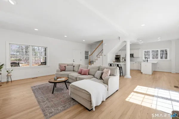 a living room with furniture and a table
