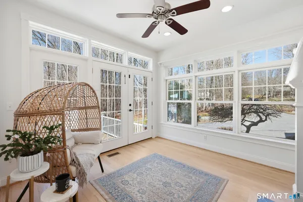 a living room with furniture and a window